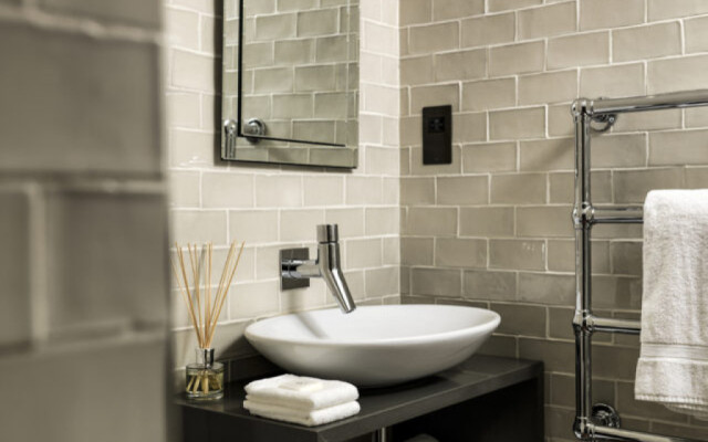 Sleek Modern Basin and Wall Tap for a Contemporary Bathroom Design