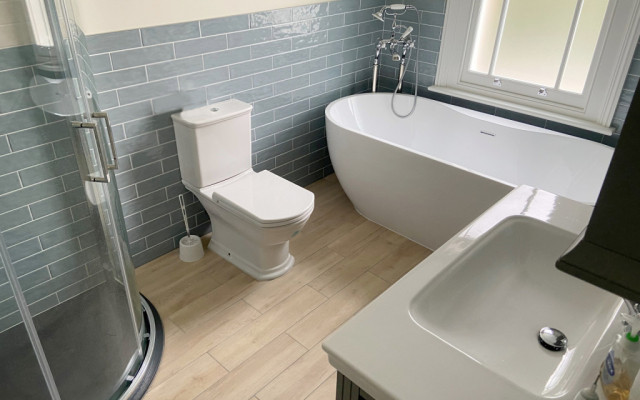 Experience the elegance of a traditional-style bathroom with modern comforts.