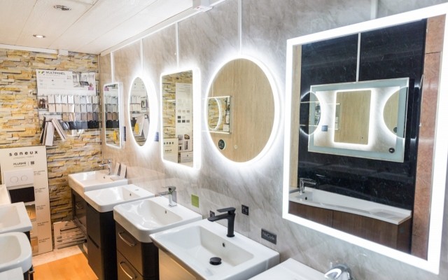 Rectangle & Circular LED Mirrors above a range of Vanity Units at Aqualite's Bathroom Showroom in Wembley, Greater London