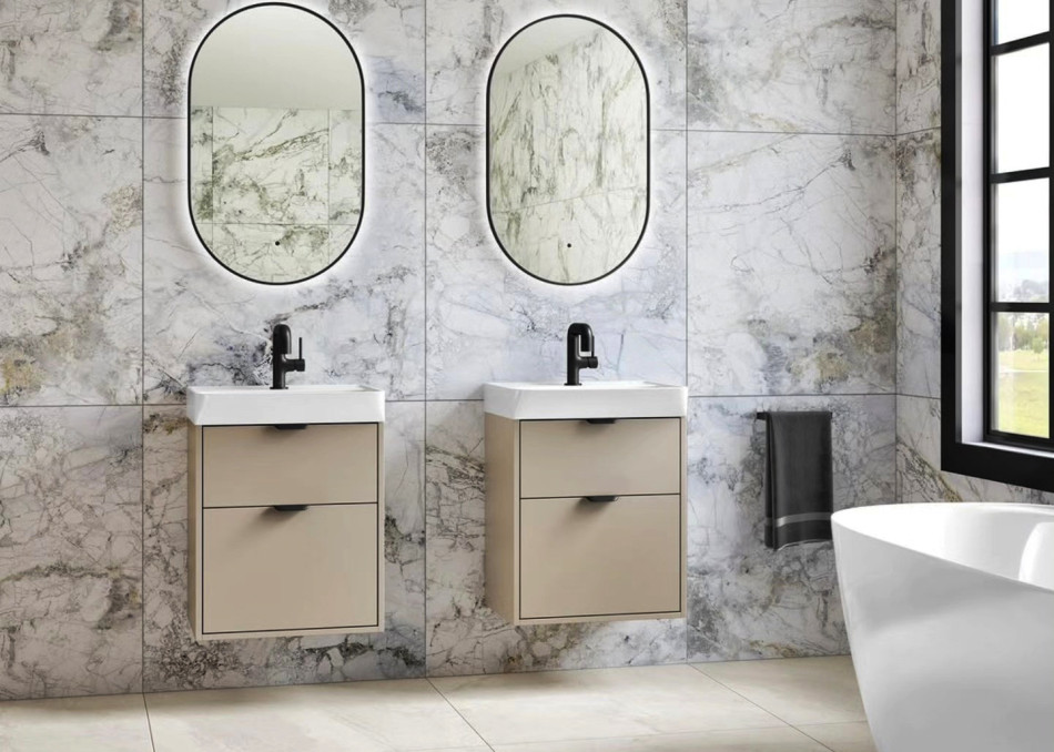 Elegant double basin units with modern design, showcasing stylish mirrors and sophisticated marble tiling.