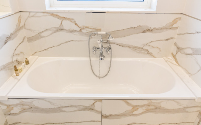 Aqualite luxury bathroom featuring a stunning bathtub design.