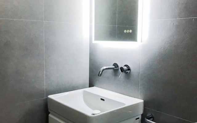 Stylish bathroom vanity mirror with integrated lighting.