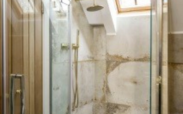 High-ceiling walking shower featuring elegant design and high-quality materials.