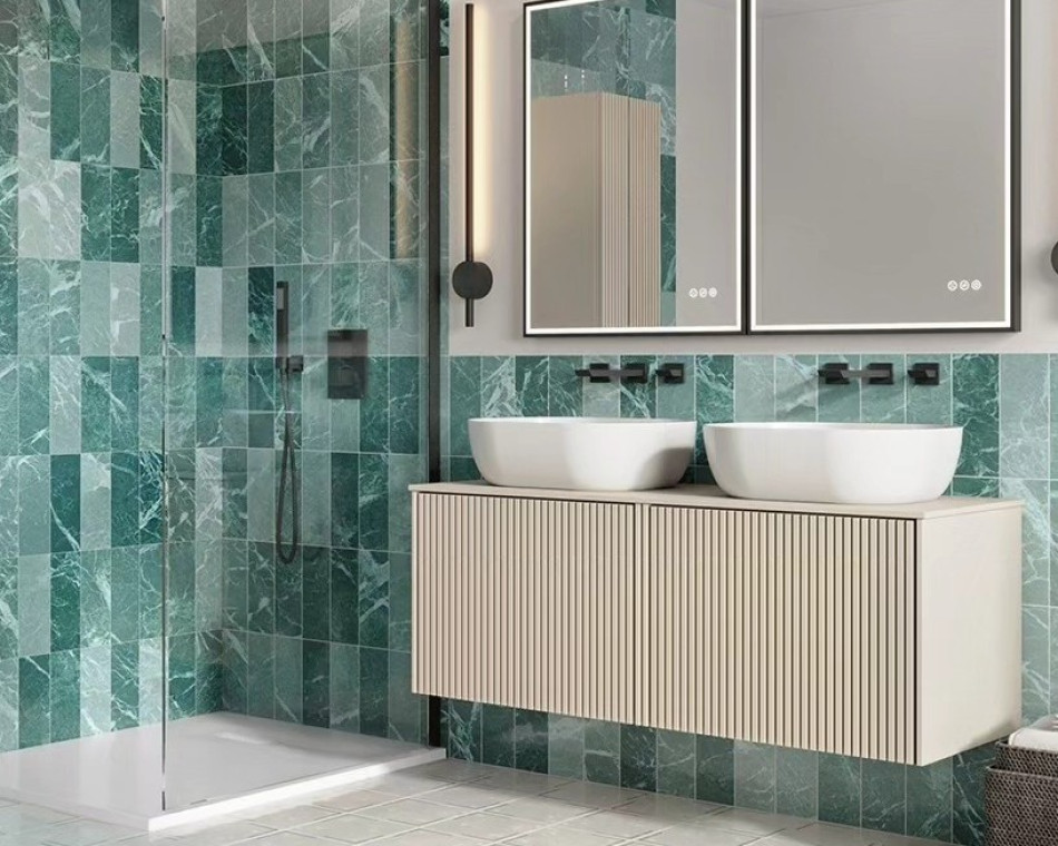 Elegant Bathroom Design featuring a stunning green marble wall and double basin sinks.