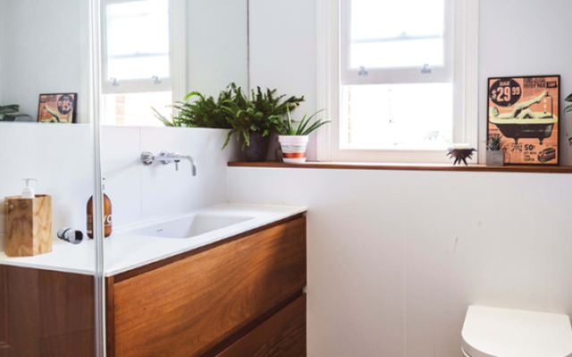 Discover the elegance of modern bathroom design with our West Hampstead bathroom suite, featuring stunning wood and sleek furnishings.