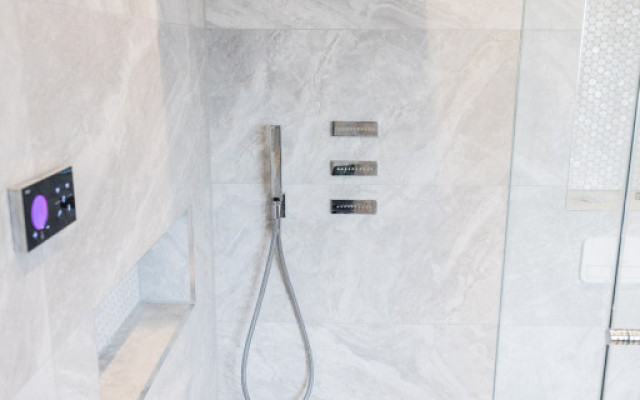 Experience a walk-in shower with luxurious design and functionality.